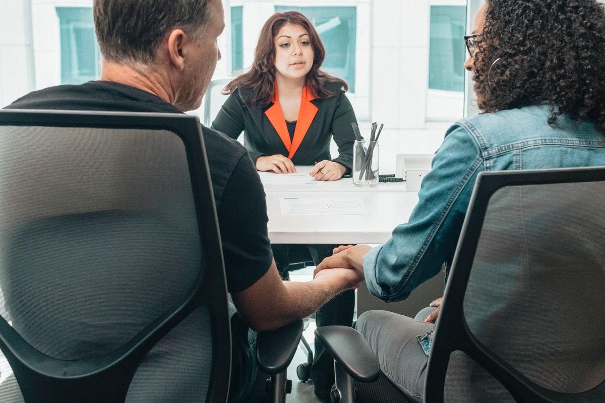Accountant explaining figures to a small business owner across a desk