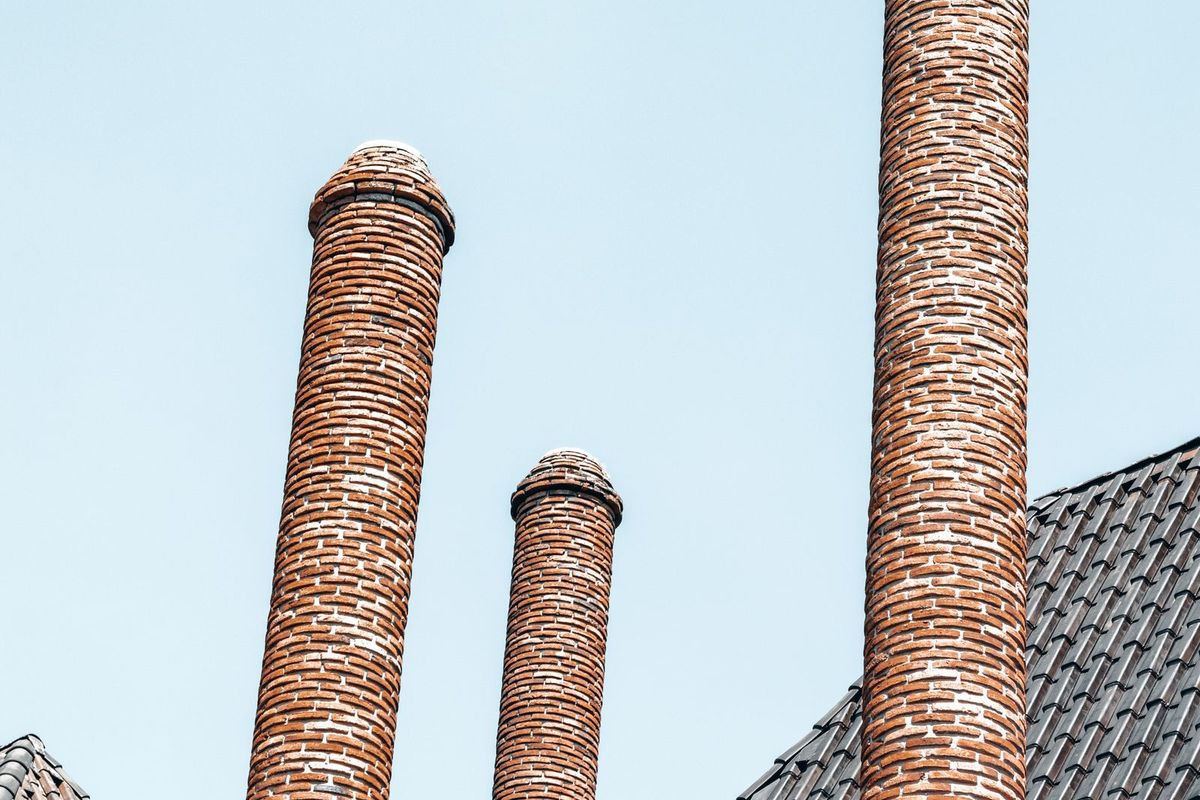 Chimney pots on a rooftop against the sky