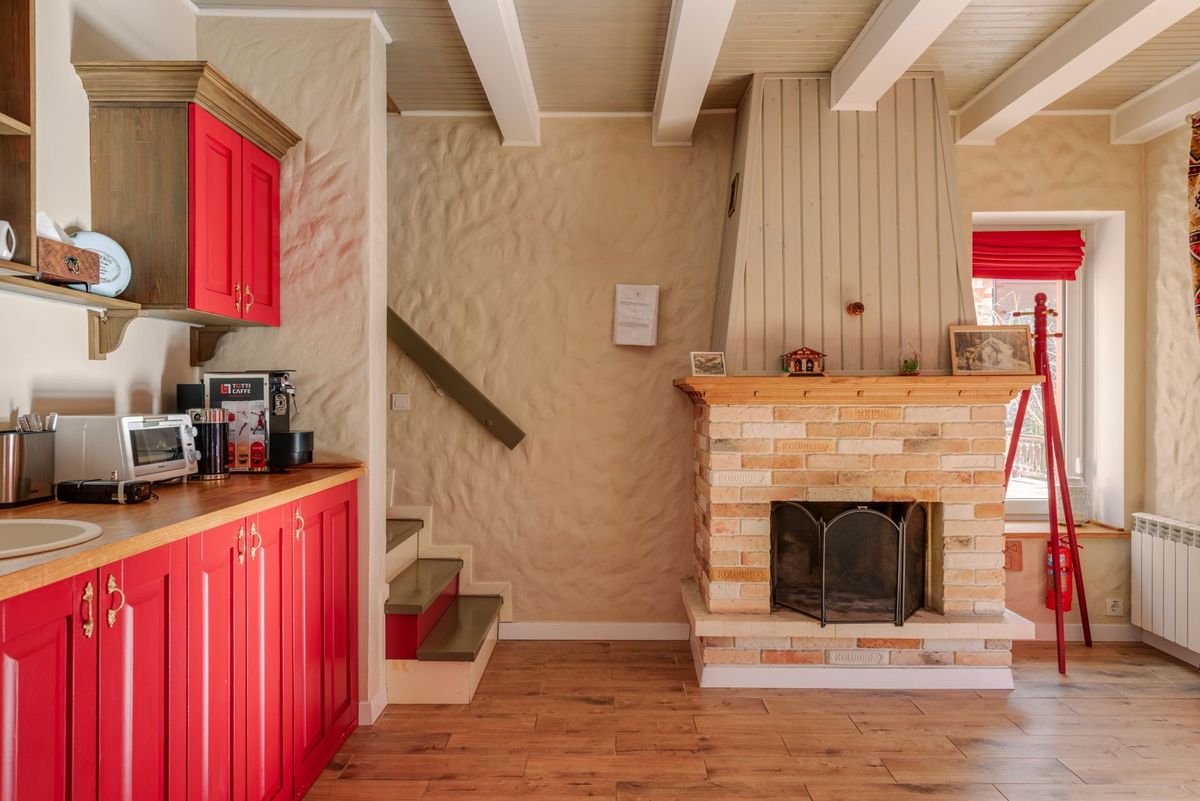 A cosy room with a fireplace and wood stove