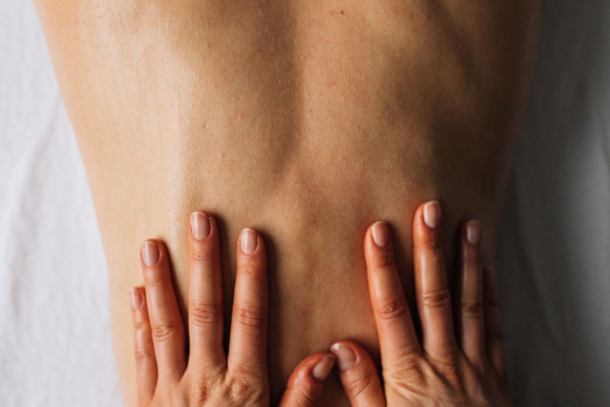 Careful hands-on manual therapy on a patient's back