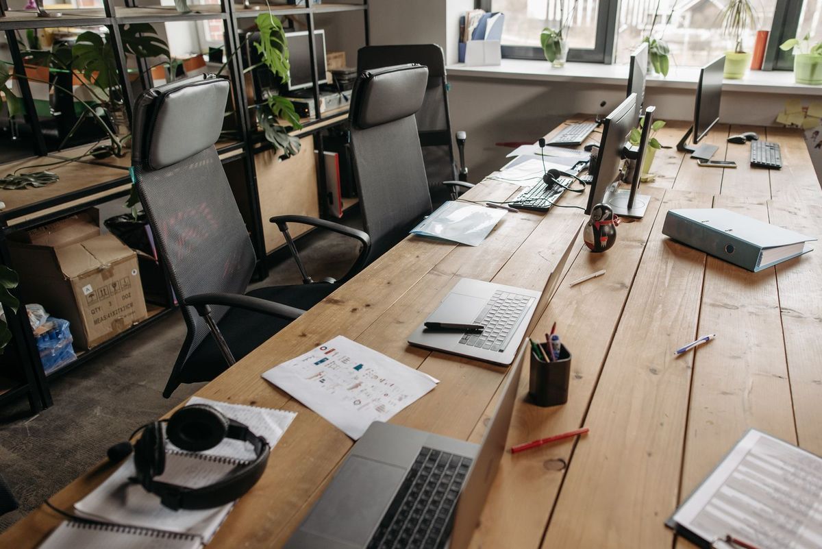 A desk with notes for auditing a website