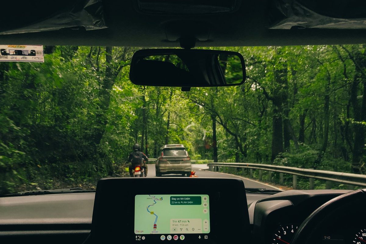 View of the road ahead through a car windscreen during a lesson