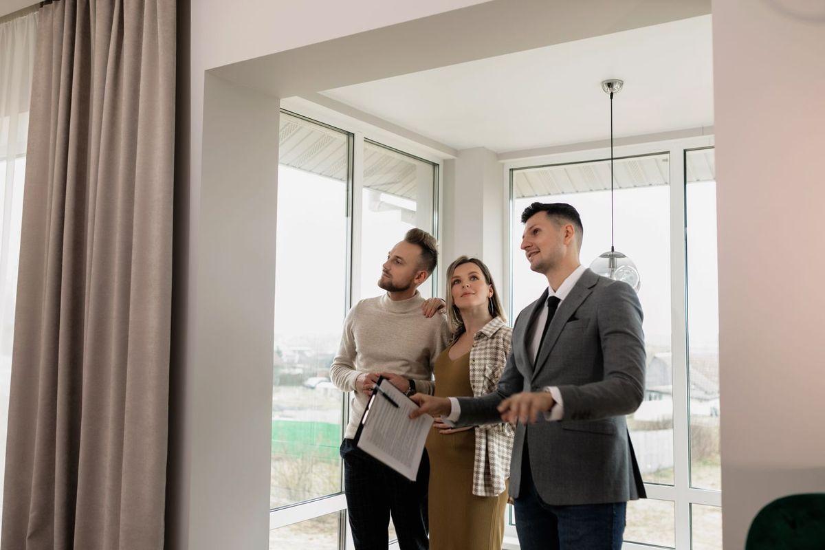 An estate agent showing clients around a property
