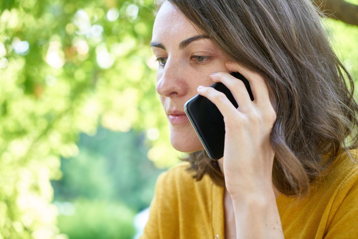Person answering a customer question on the phone