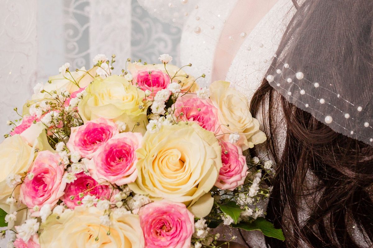 A bride holding a wedding bouquet