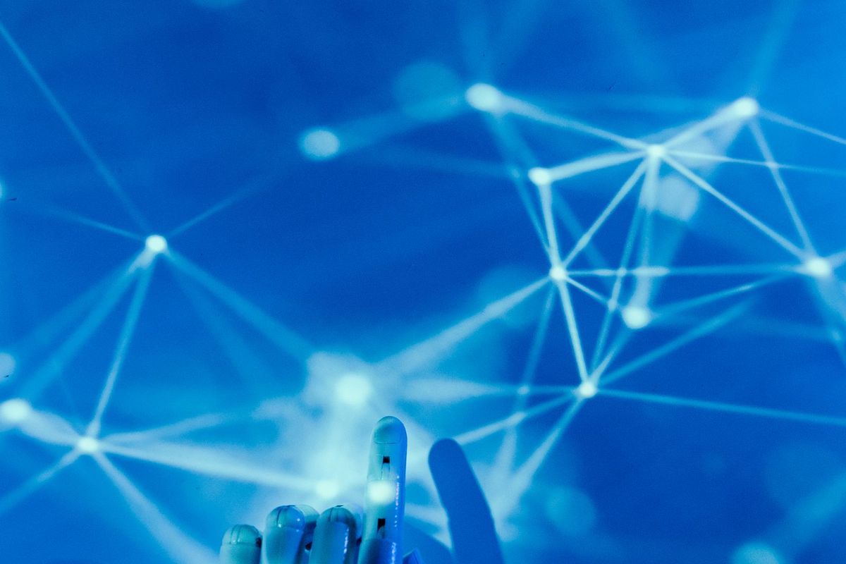 Illustration of an AI hand touching a network of connections