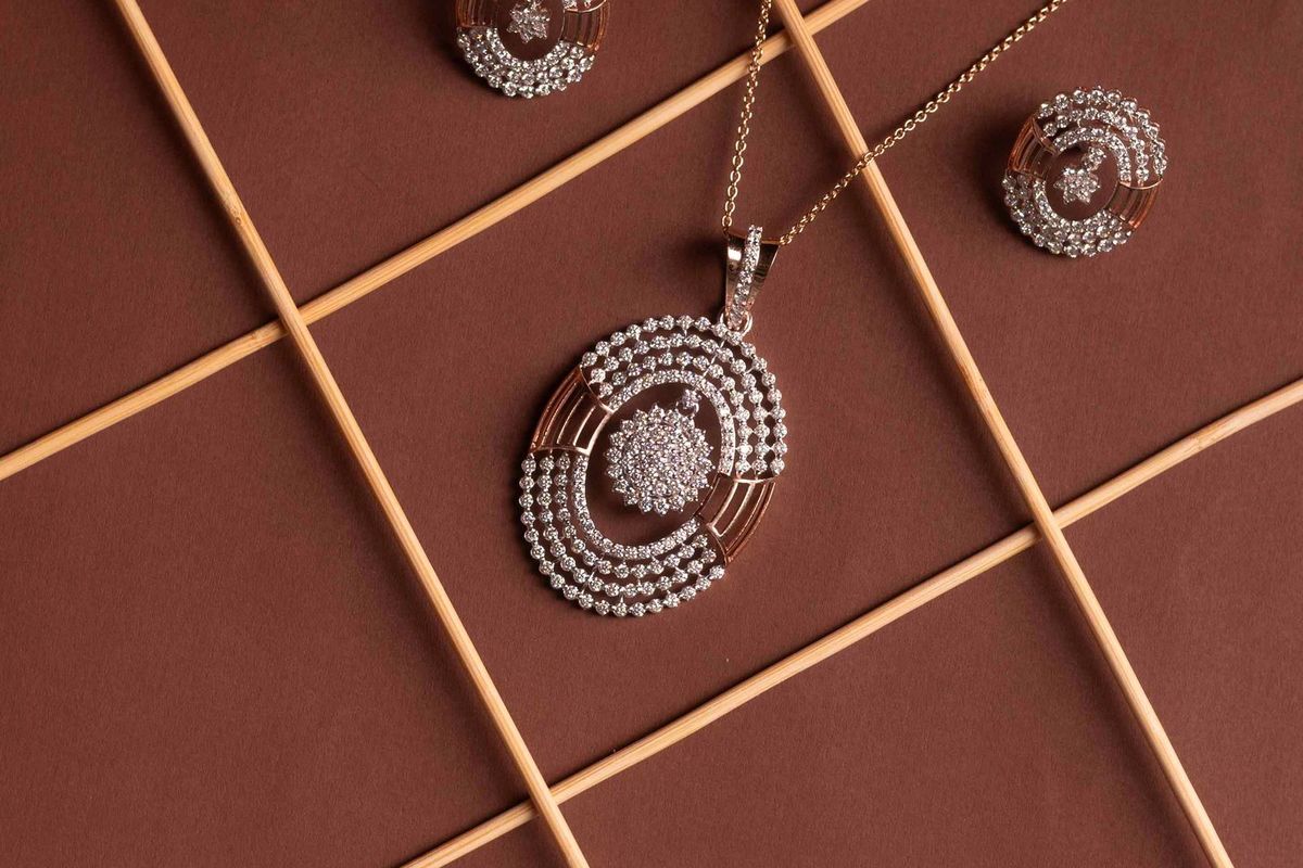 An elegant necklace and earrings displayed on a surface