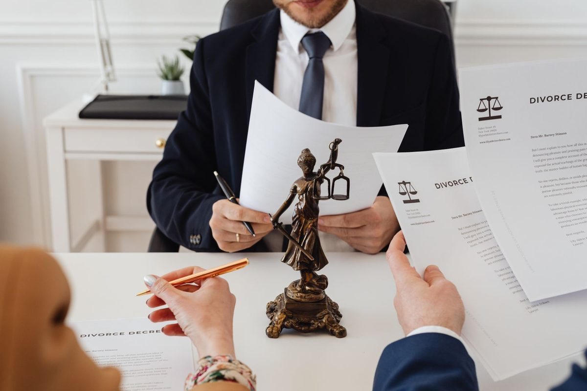 Client and solicitor reviewing separation documents at a desk