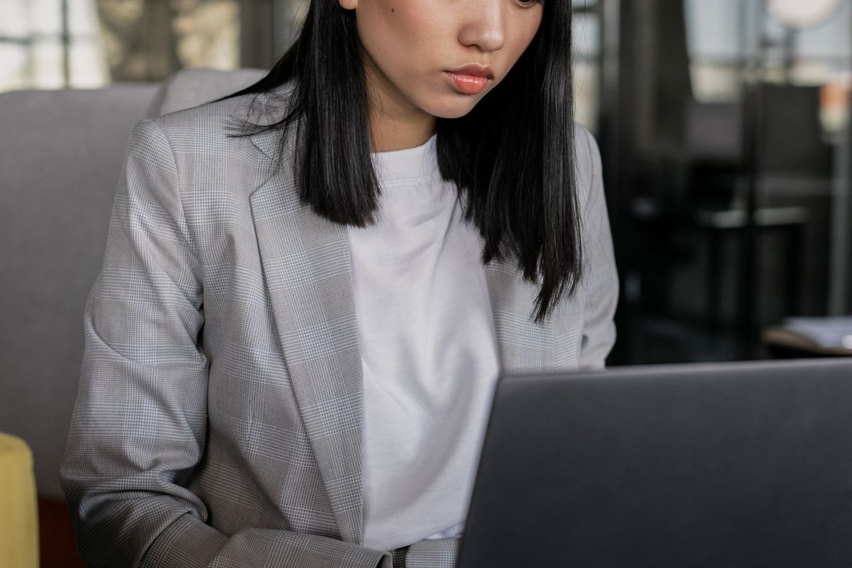 Person managing their business details on a laptop