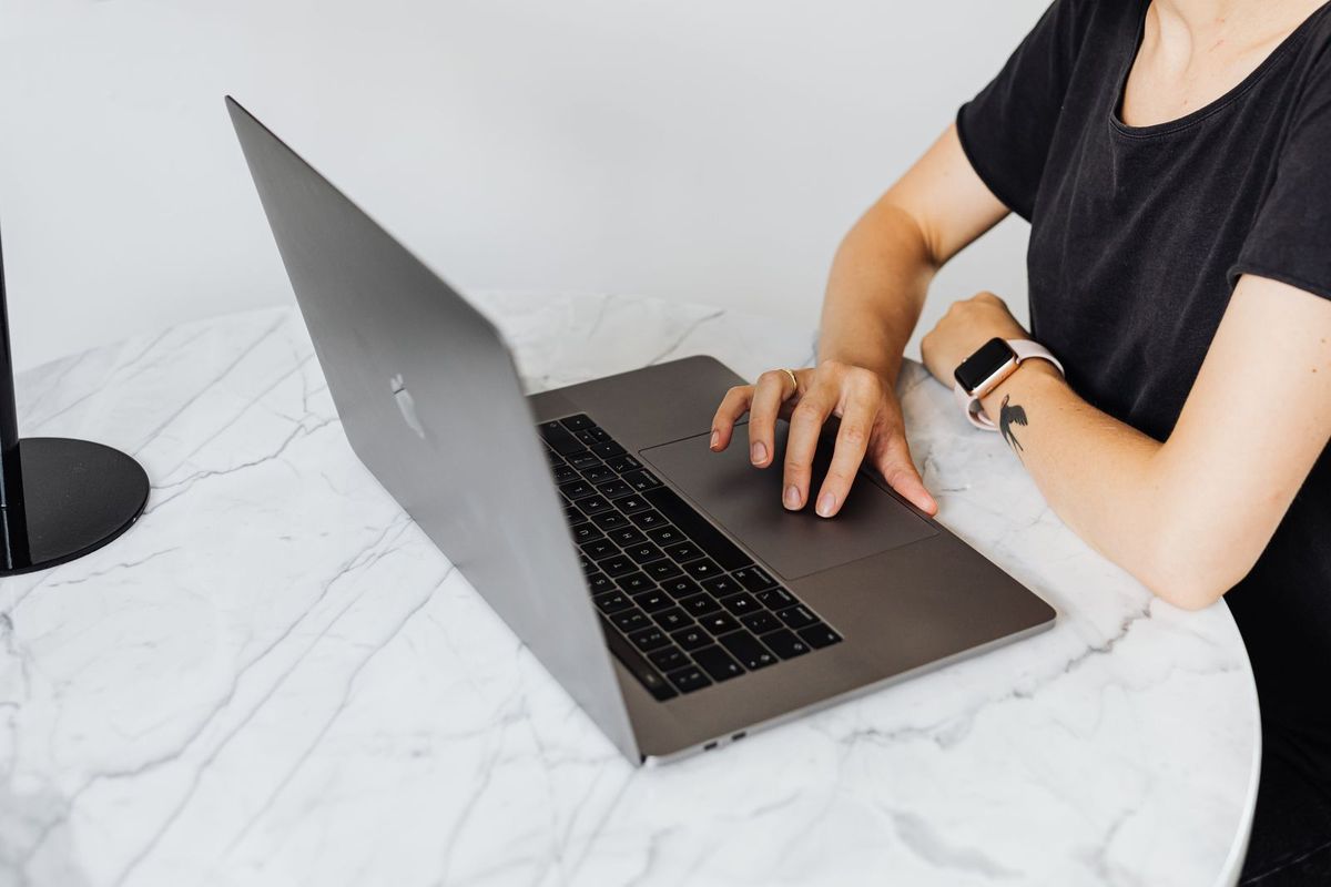 Person tidying up business listings on a laptop