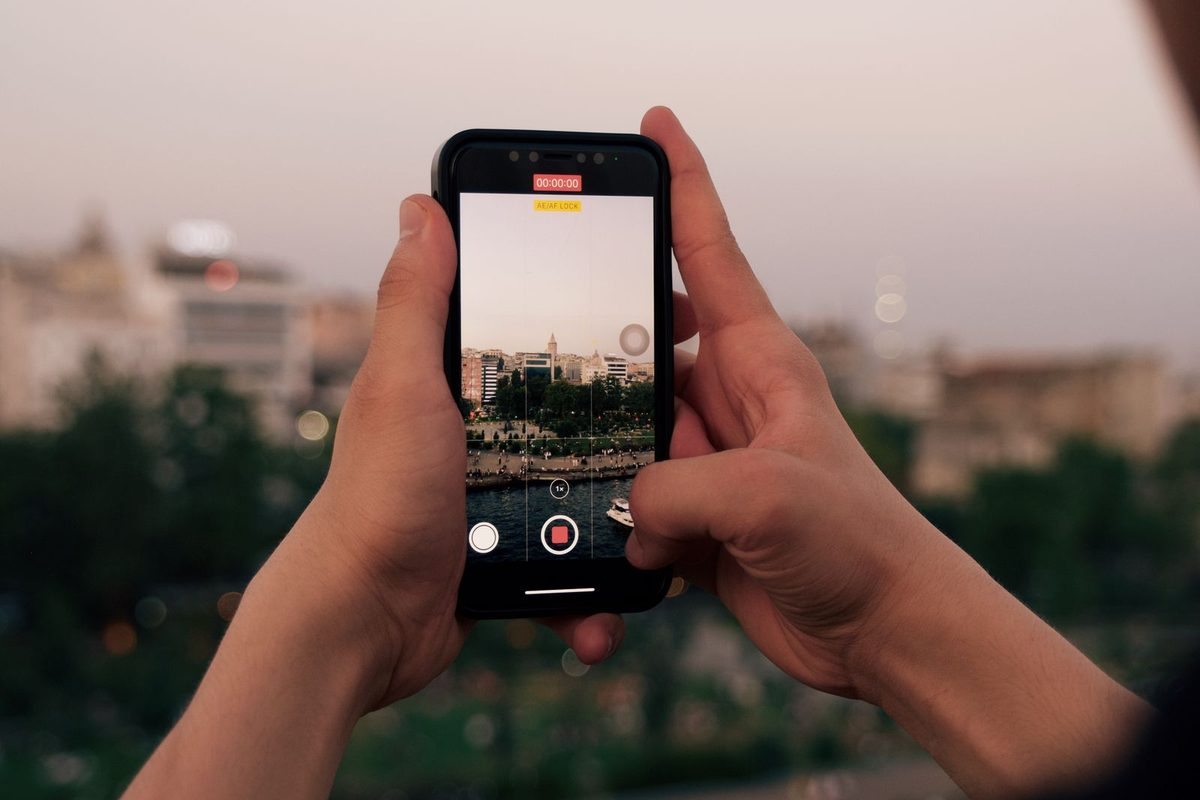 Person using a smartphone outdoors while out and about