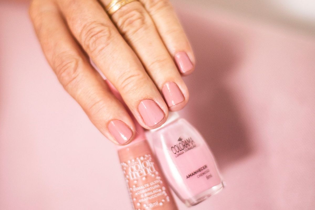 Elegant finished manicure with a bottle of nail polish