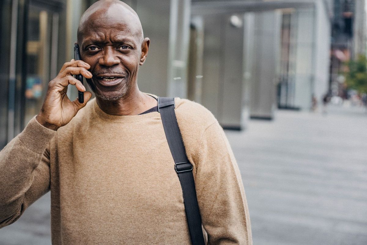 Person searching on a phone while out on the street