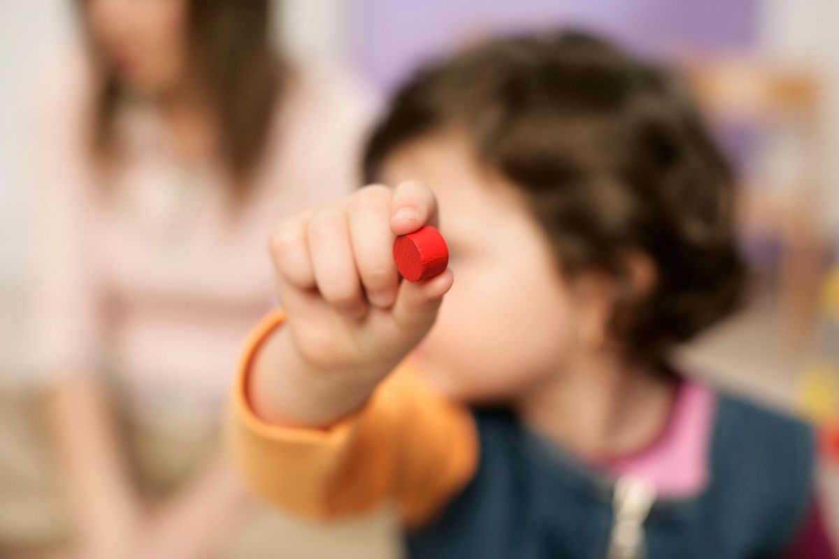 A young child engaged and learning through play