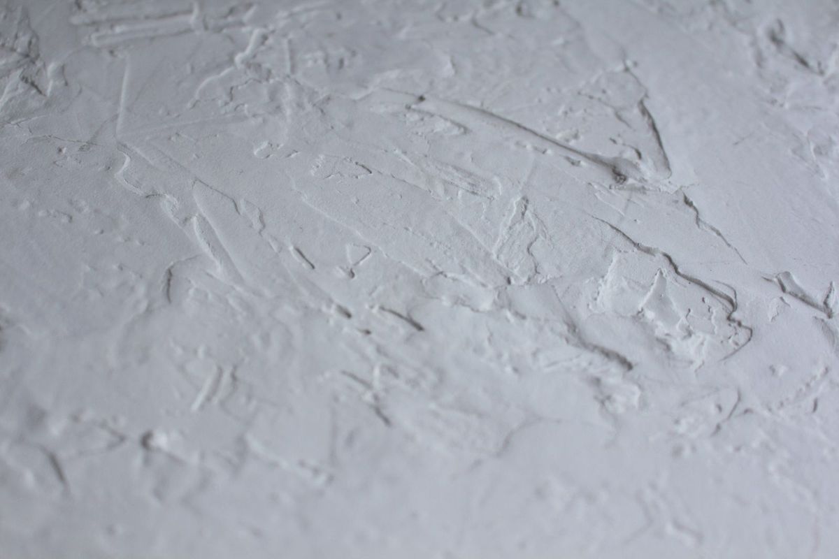 Fresh wet plaster being applied to a wall
