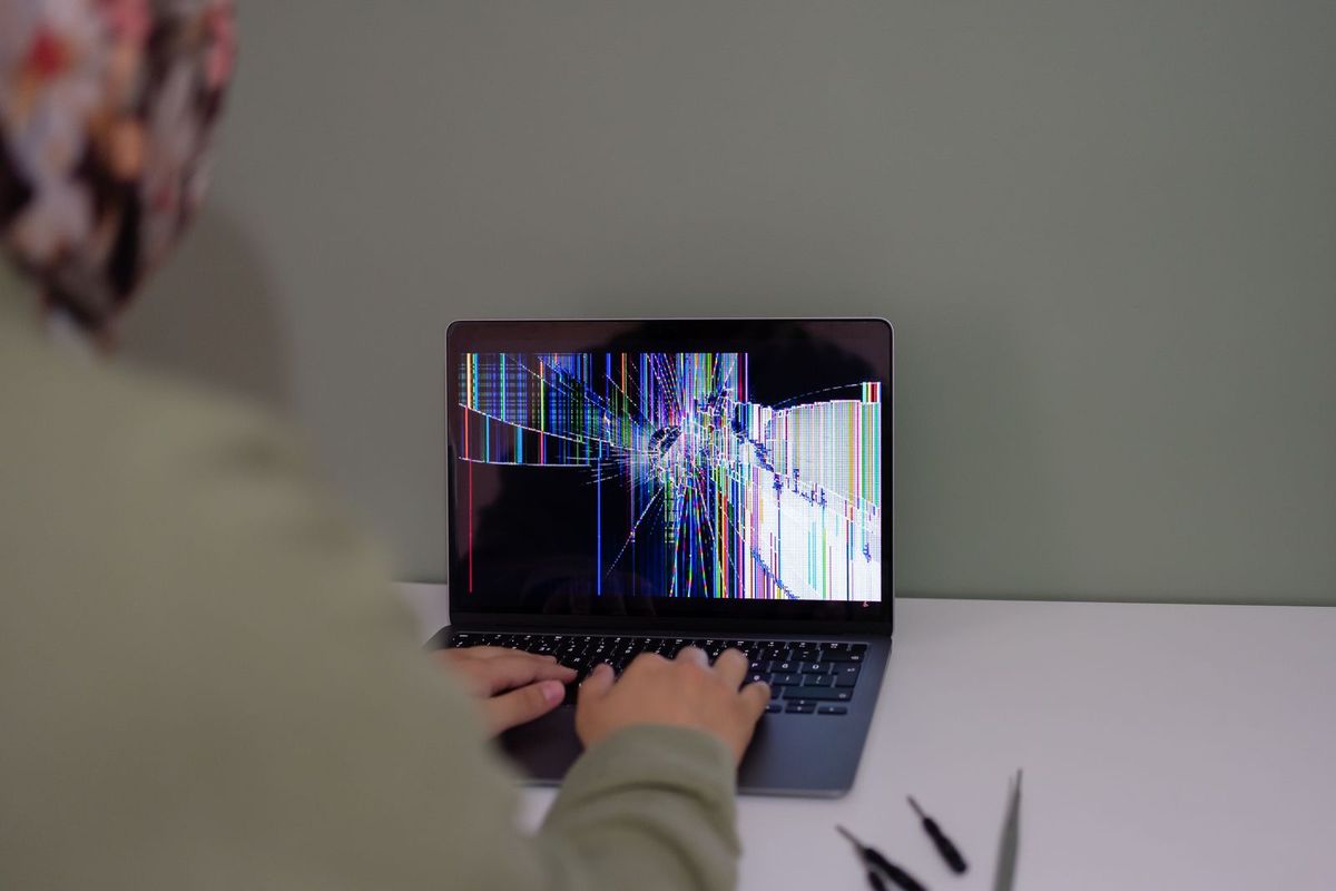 Person handling data carefully on a laptop