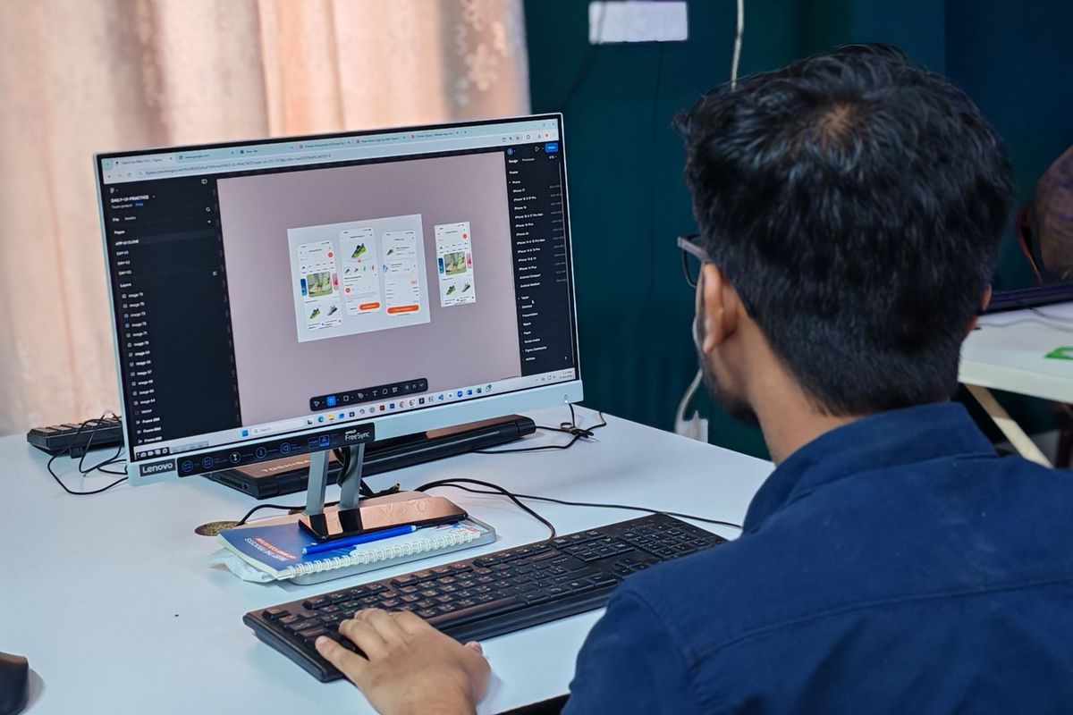 Designer laying out a web page on a large screen