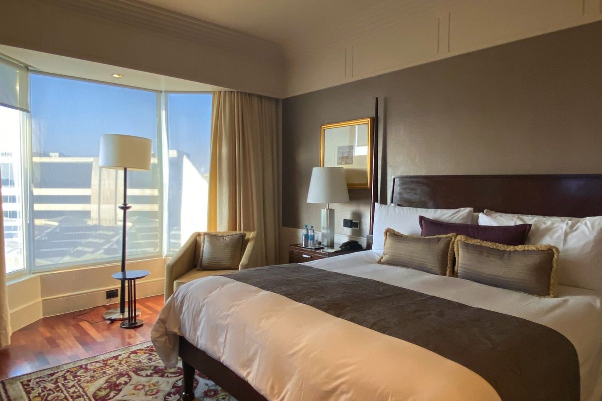 Comfortable boutique hotel room with a large bed and warm lighting