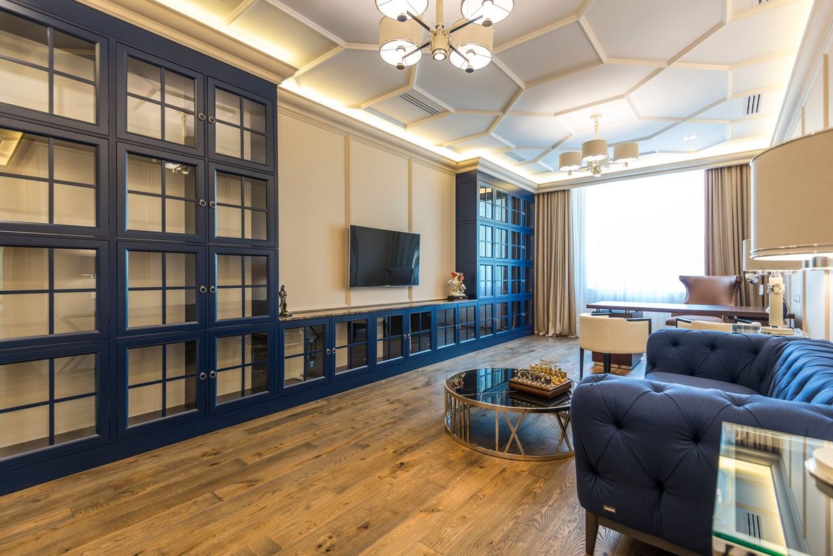 Modern hotel suite with a lounge area and a city view