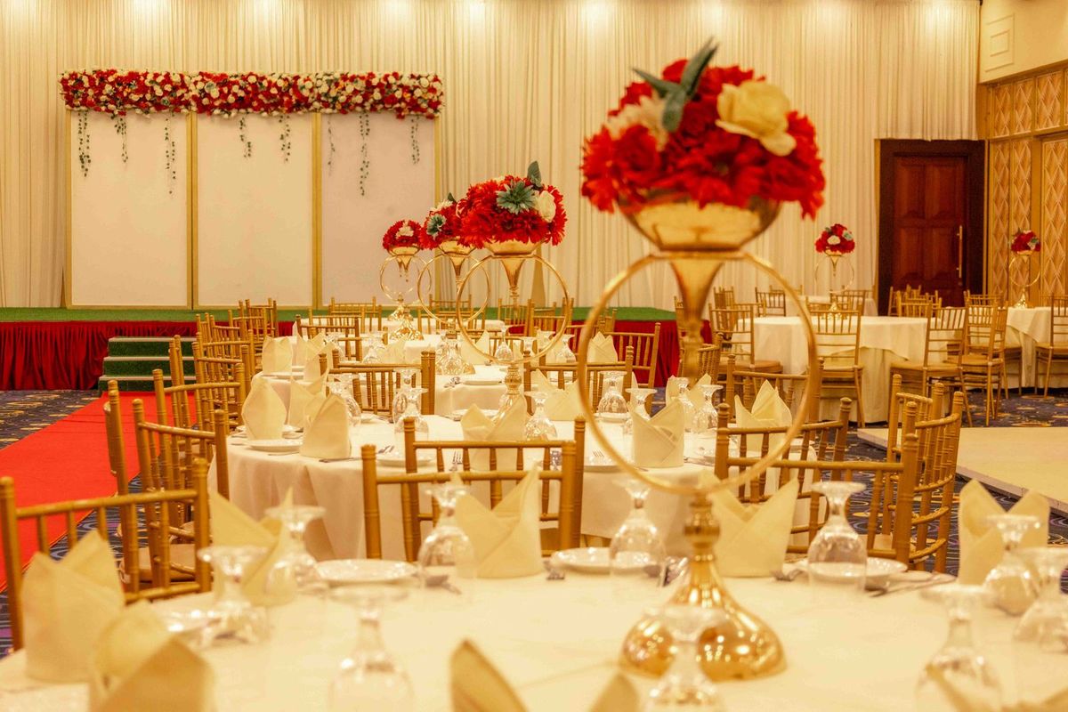 A beautifully styled wedding reception with floral centrepieces