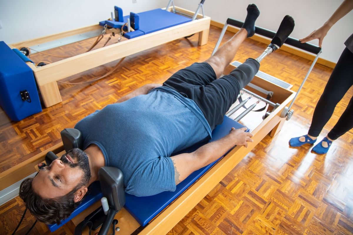 Pilates reformer class in a studio